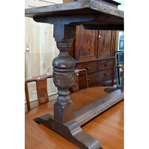 683 - A small burr elm refectory table with cleated ends, on cup and cover supports, 122 x 56 cm