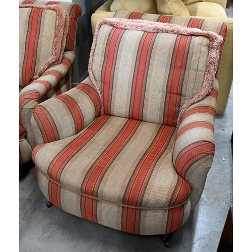 688 - A pair of mahogany framed country house armchairs in red/beige striped fabric upholstery