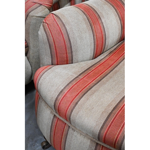 688 - A pair of mahogany framed country house armchairs in red/beige striped fabric upholstery