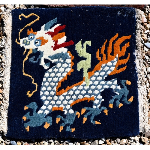 690 - A Persian Quashqai bag face to/w Peking 'dragon' mat, fragment of blue fabric and hessian cushion ba... 