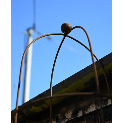 76 - A pair of weathered steel ball head obelisk plant frames, approx. 210 cm h (2)