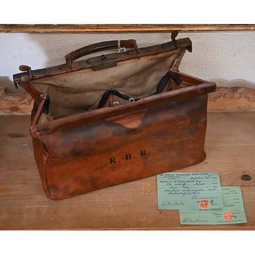 527 - An antique lead-weighted exercise skittle, 65 cm high, to/w a small vintage leather Gladstone bag an... 