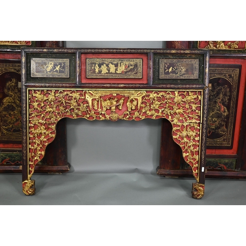 320A - A 19th century Chinese red and black lacquered three section wedding bed panel decoratively carved a... 