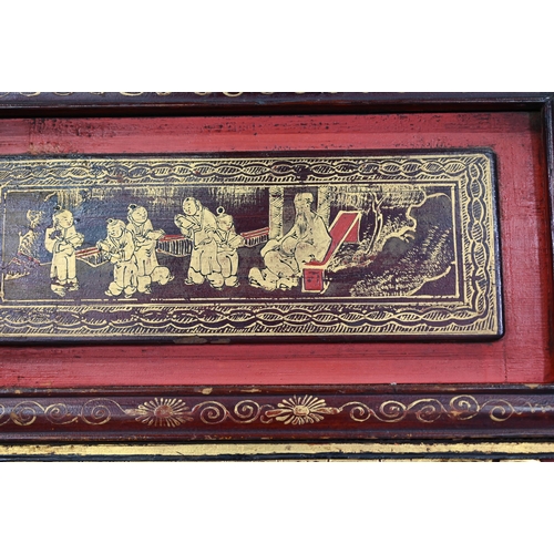 320A - A 19th century Chinese red and black lacquered three section wedding bed panel decoratively carved a... 