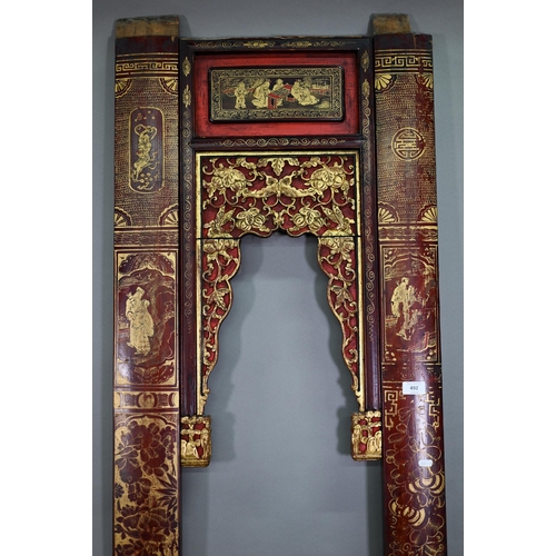 320A - A 19th century Chinese red and black lacquered three section wedding bed panel decoratively carved a... 