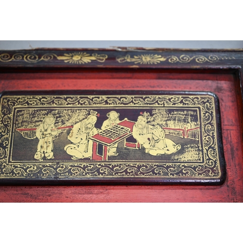 320A - A 19th century Chinese red and black lacquered three section wedding bed panel decoratively carved a... 