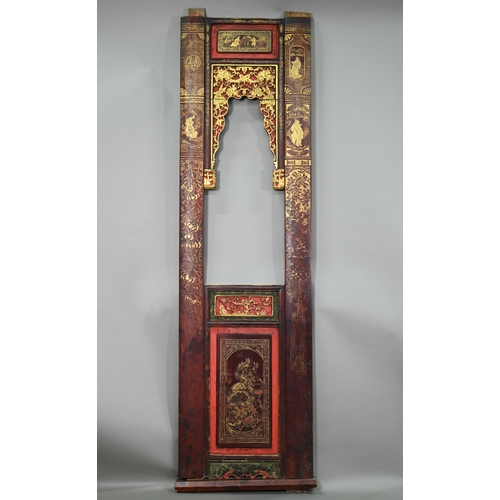 320A - A 19th century Chinese red and black lacquered three section wedding bed panel decoratively carved a... 