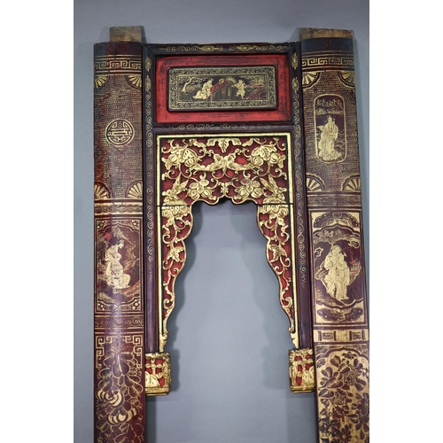 320A - A 19th century Chinese red and black lacquered three section wedding bed panel decoratively carved a... 