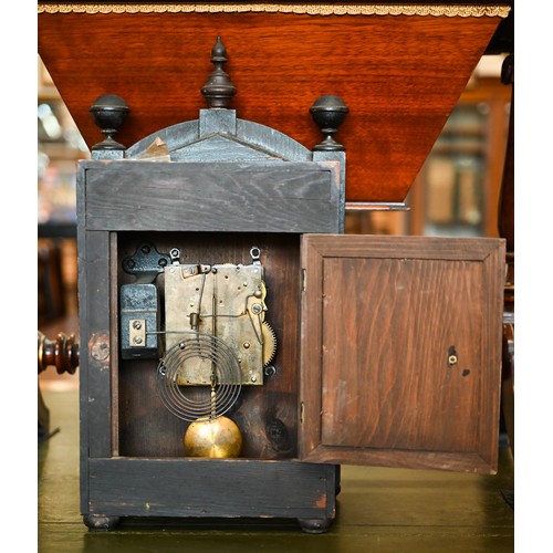 550 - An early 20th century German stained pine mantel clock, glazed door enclosing the brass and silvered... 