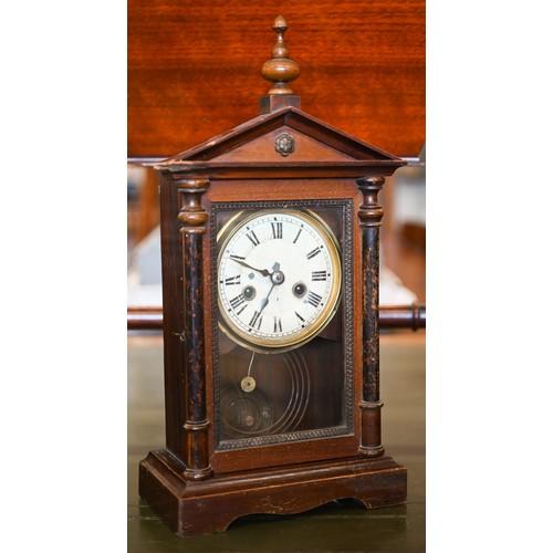 550 - An early 20th century German stained pine mantel clock, glazed door enclosing the brass and silvered... 