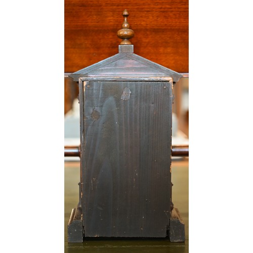 550 - An early 20th century German stained pine mantel clock, glazed door enclosing the brass and silvered... 