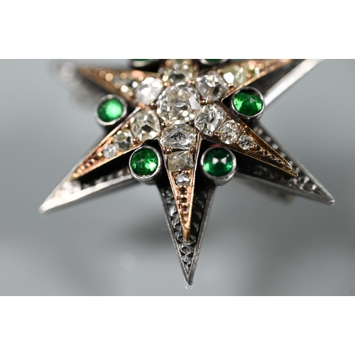 289 - A Victorian diamond and emerald star-shaped brooch, the six point star gold set with mixed cut diamo... 