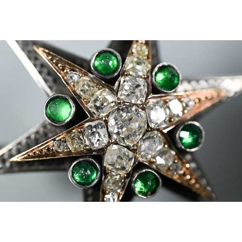 289 - A Victorian diamond and emerald star-shaped brooch, the six point star gold set with mixed cut diamo... 