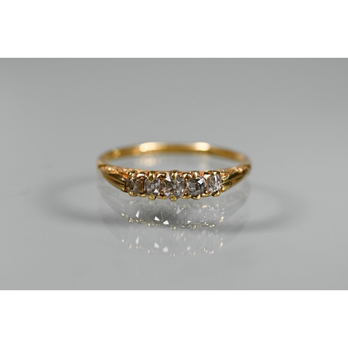 291 - An antique five stone diamond ring, the old cut graduated diamonds in 18ct yellow gold shank, fully ... 