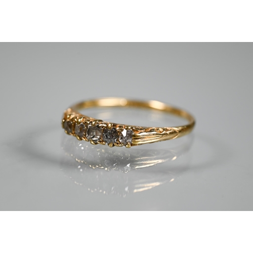 291 - An antique five stone diamond ring, the old cut graduated diamonds in 18ct yellow gold shank, fully ... 