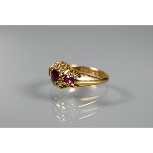 293 - An antique ruby and diamond cluster ring, the central oval ruby surrounded by small eight-cut diamon... 