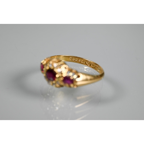 293 - An antique ruby and diamond cluster ring, the central oval ruby surrounded by small eight-cut diamon... 