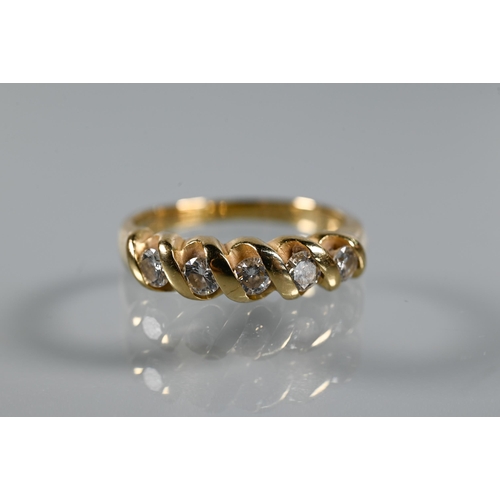 294 - A five-stone diamond ring, the round brilliant cut diamonds in rope-style setting, yellow metal stam... 