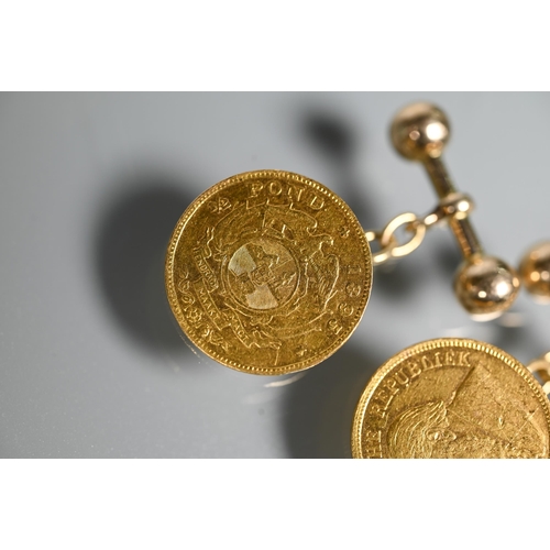 296 - A pair of South African 1/2 Pond coins dated 1895, set as cufflinks with 18ct chain and bar, approx ... 