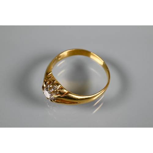 311 - A Victorian single stone diamond ring in yellow gold, the old European cut stone claw set in a gentl... 