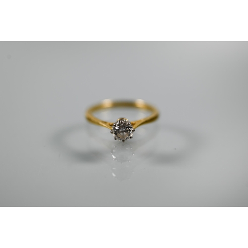 314 - A single stone diamond ring, the brilliant cut diamond in coronet setting with scroll shoulders, 18c... 