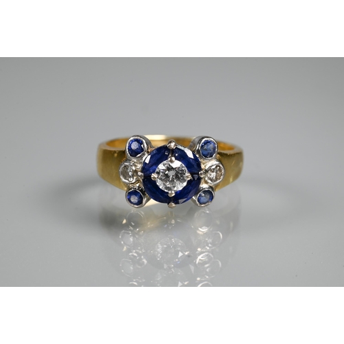 316 - An sapphire and diamond cluster ring, the central round brilliant cut diamond surrounded by four mar... 