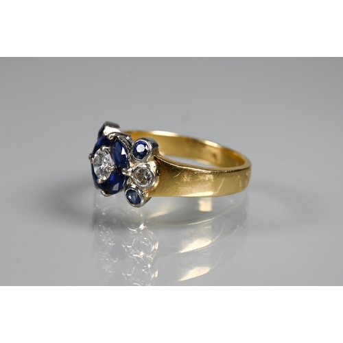 316 - An sapphire and diamond cluster ring, the central round brilliant cut diamond surrounded by four mar... 