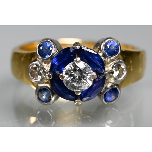 316 - An sapphire and diamond cluster ring, the central round brilliant cut diamond surrounded by four mar... 