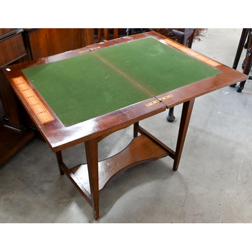 134 - An Edwardian walnut bridge/card table with rotating baize lined folding top and end drawer, 60 cm wi... 