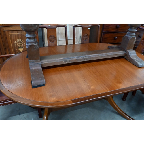 247 - # A mid-century Meredew teak and afromosia oval dining table, 195 x 95 cm