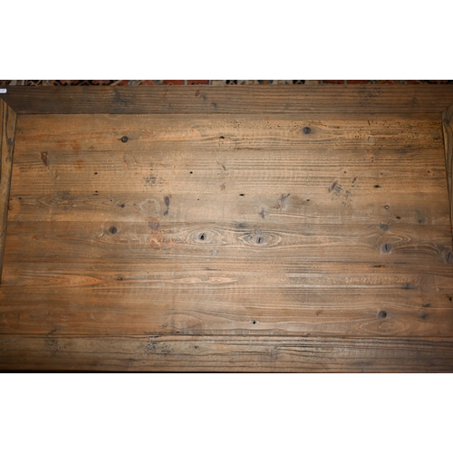 343 - # A rustic steel bound reclaimed pine two-tier coffee table, 120 cm x 70 cm x 40 cm h