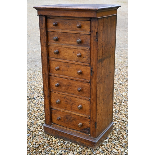 536 - A Victorian oak secretaire Wellington chest of drawers, with original turned fittings raised on a pl... 