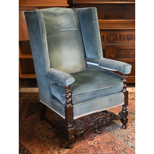 110 - #An Arts & Crafts oak framed wingback armchair in blue dralon upholstery, 80 cm w x 55 cm d x 17... 