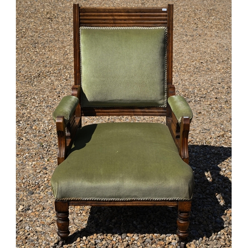 108 - An Edwardian green dralon upholstered walnut framed salon armchair, on castors