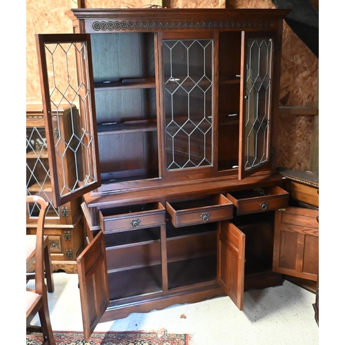 113 - An Old Charm oak half lead lattice glazed bookcase cabinet, with drawers and cupboards, 134 cm x 45 ... 