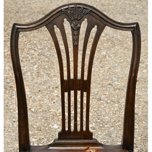 116 - A set of six Hepplewhite style mahogany dining chairs, carved with wheatsheaf motif and with brown l... 