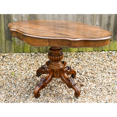 119 - A Victorian style bright mahogany centre table, with frieze drawer to each side, raised on four moul... 