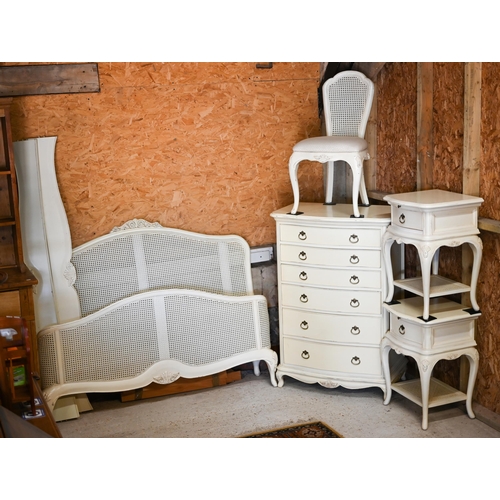 125 - Willis & Gambier - a part off-white finished bedroom suite, comprising a bergere ended kingsize ... 