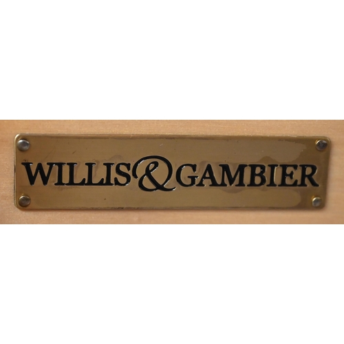 125 - Willis & Gambier - a part off-white finished bedroom suite, comprising a bergere ended kingsize ... 