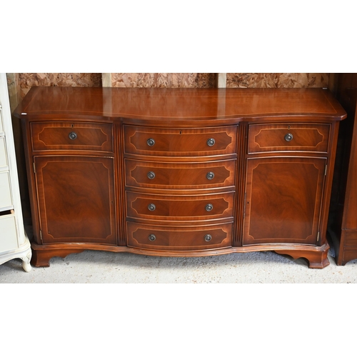 127 - Brights of Nettlebed, a Victorian style serpentine front cross-banded bright mahogany sideboard, cen... 