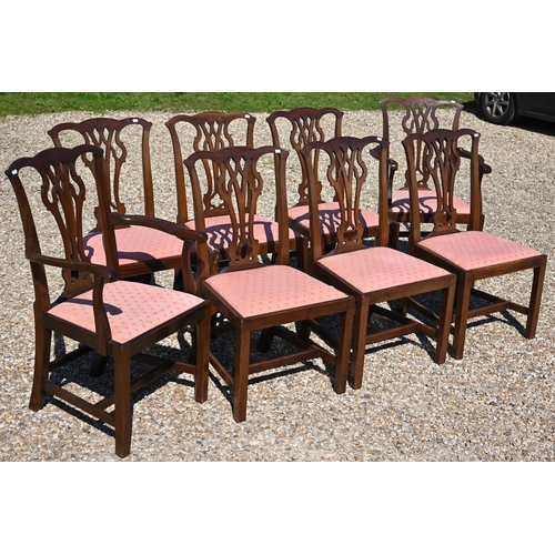 128 - A set of eight George III style mahogany ear-back dining chairs, with pink fabric seat pads comprisi... 