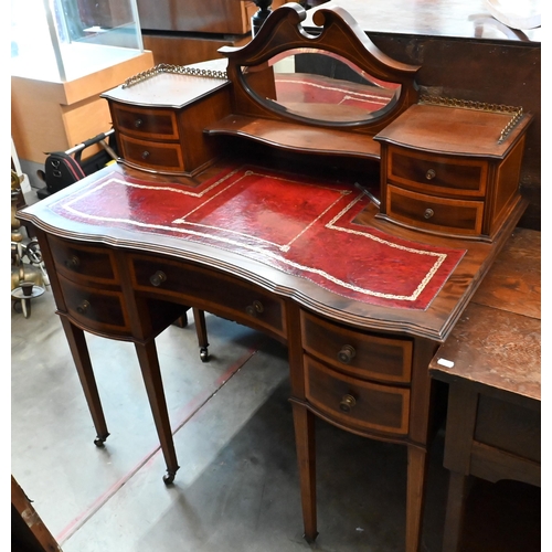 132 - An Edwardian mahogany crossbanded writing desk with tooled red leather top, bevelled mirror and eigh... 