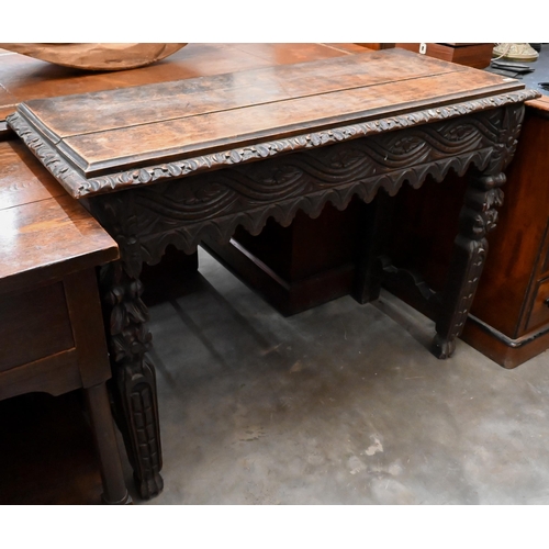 135 - A continental carved oak console table, 104 x 42 x 78 cm high