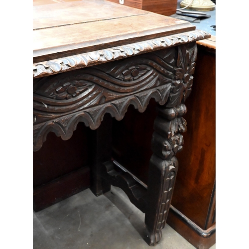 135 - A continental carved oak console table, 104 x 42 x 78 cm high