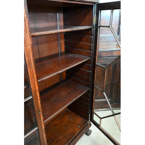 137 - A mahogany bookcase with astragal glazed doors enclosing adjustable shelves on ball and claw feet, 1... 