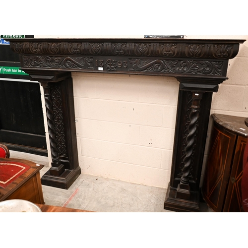 142 - A Victorian carved oak fire surround dated '1893'. with barley twist pillars, 188 x 40 x 150 cm over... 