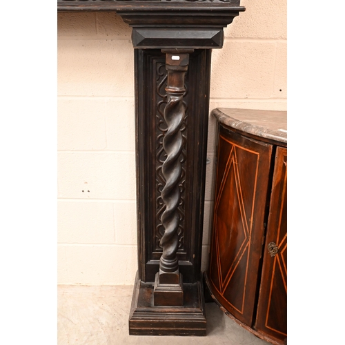 142 - A Victorian carved oak fire surround dated '1893'. with barley twist pillars, 188 x 40 x 150 cm over... 