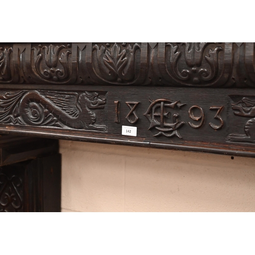 142 - A Victorian carved oak fire surround dated '1893'. with barley twist pillars, 188 x 40 x 150 cm over... 