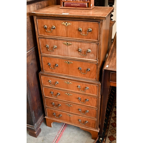 145 - A reproduction mahogany chest on chest with seven drawers (one piece) on bracket feet, 48 x 34 x 100... 