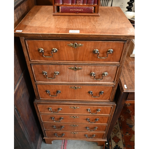 145 - A reproduction mahogany chest on chest with seven drawers (one piece) on bracket feet, 48 x 34 x 100... 